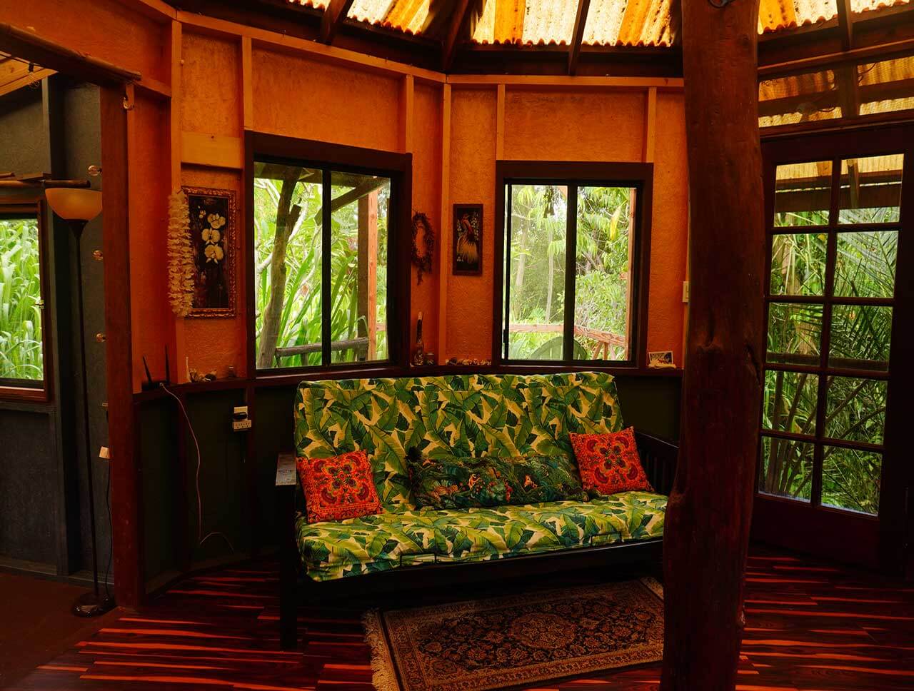 Hale Mandala view of living room with futon - Earthsong Hawaii