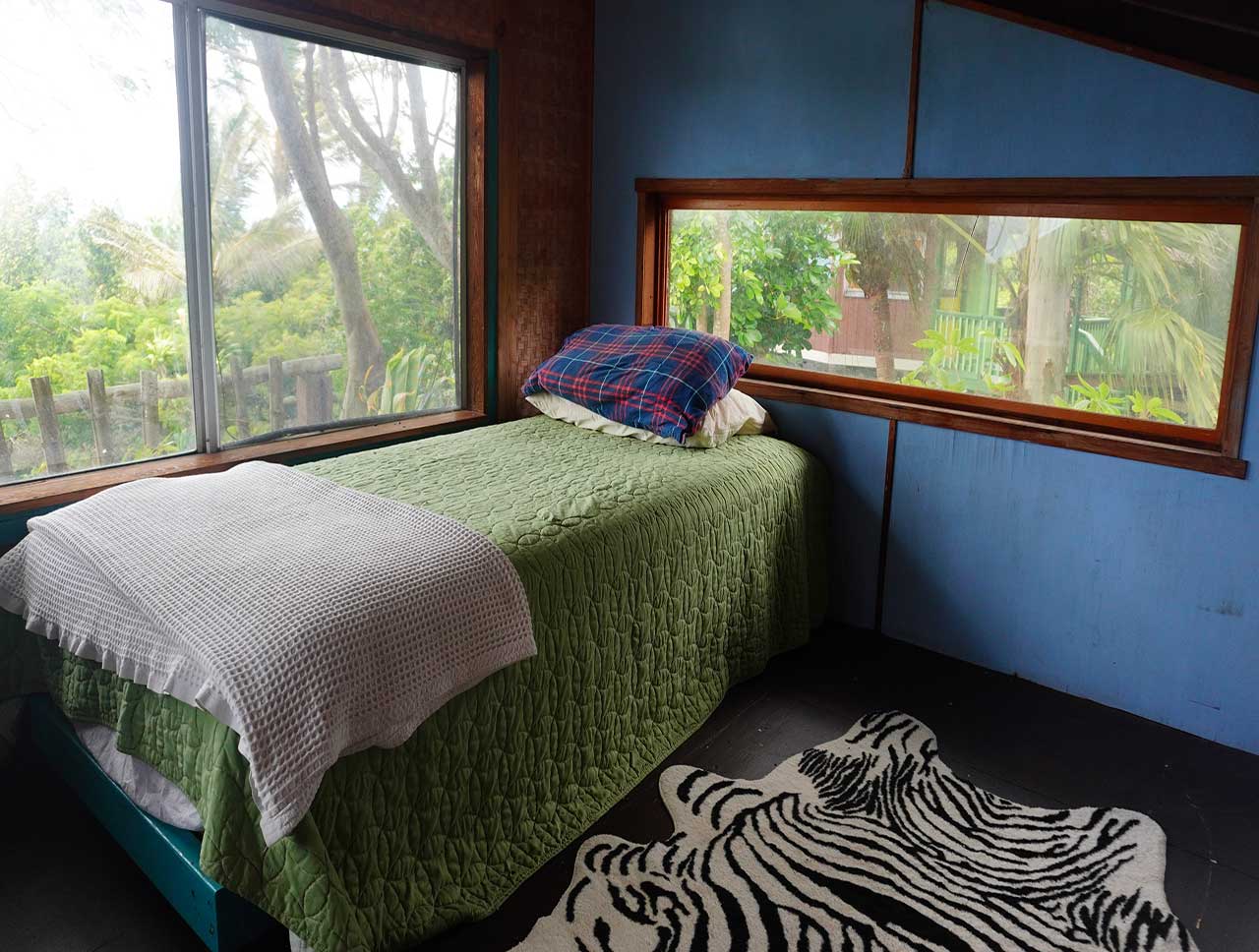Shakti Residence view of loft with bed - Earthsong Hawaii